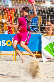 CADIZ, SPAIN - JULY 19: Unidentified players compete in a match between Autoescuela Barquin and CadizSur Seguros BMPY in the 19th league of beach handball of Cadiz on July 19, 2011 in Cadiz, Spain