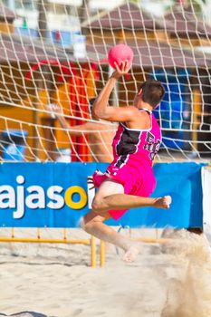 CADIZ, SPAIN - JULY 19: Unidentified players compete in a match between Autoescuela Barquin and CadizSur Seguros BMPY in the 19th league of beach handball of Cadiz on July 19, 2011 in Cadiz, Spain