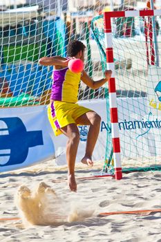 CADIZ, SPAIN - JULY 19: Unidentified players compete in a match between Los Negritos and Ademar Adentro in the 19th league of beach handball of Cadiz on July 19, 2011 in Cadiz, Spain