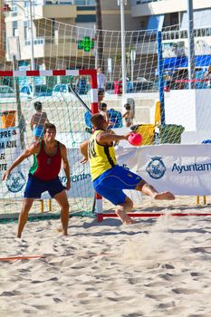 CADIZ, SPAIN - JULY 19: Unidentified players compete in a match between Los Negritos and Ademar Adentro in the 19th league of beach handball of Cadiz on July 19, 2011 in Cadiz, Spain