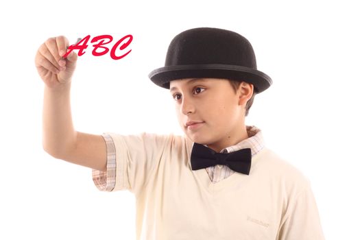 Young  boy with bowler hat writing alphabet