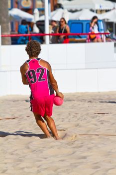 CADIZ, SPAIN - JULY 19: Unidentified players compete in a match between Autoescuela Barquin and CadizSur Seguros BMPY in the 19th league of beach handball of Cadiz on July 19, 2011 in Cadiz, Spain