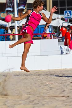 CADIZ, SPAIN - JULY 19: Unidentified players compete in a match between Autoescuela Barquin and CadizSur Seguros BMPY in the 19th league of beach handball of Cadiz on July 19, 2011 in Cadiz, Spain