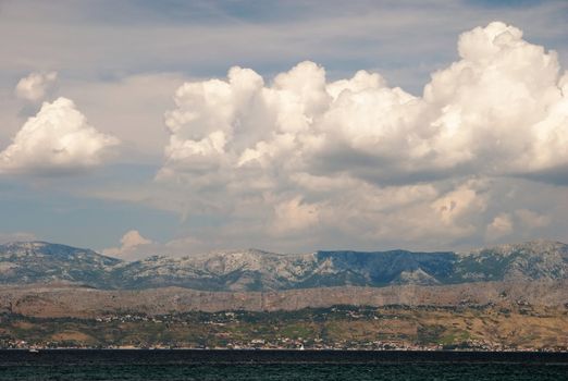 oversea View from Mediterranean island Brac to the land with cloud formation on the sky