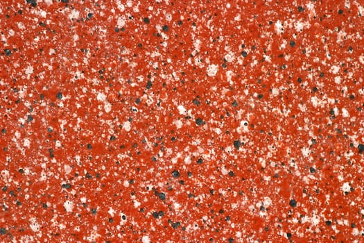 A fake granite as background with black and white sprinkles.
