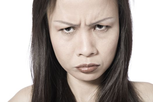 Studio portrait of a asian girl looking angry