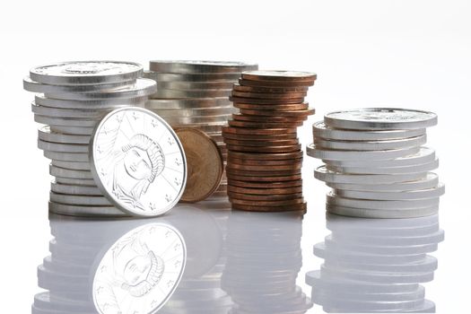 Silver and gold coins in stacks
