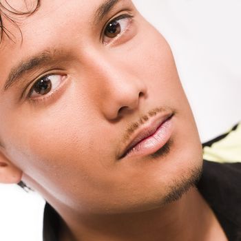 Studio portrait of mixed race young man looking concentrated