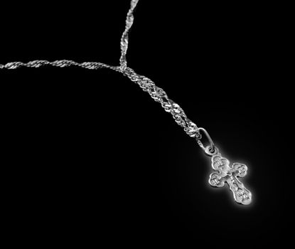 Silver chain with a dagger glow. The crucifixion