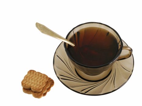 tea and cookie. Glass transparent cup with tea and cookie. Heat-tolerant utensils 