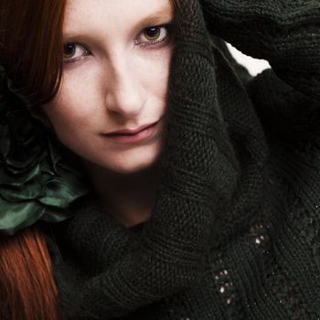 Studio portrait of a natural redhead looking serious