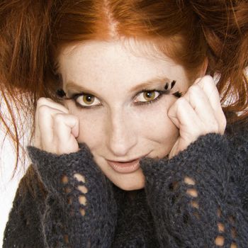 Studio portrait of a natural redhead making a funny face