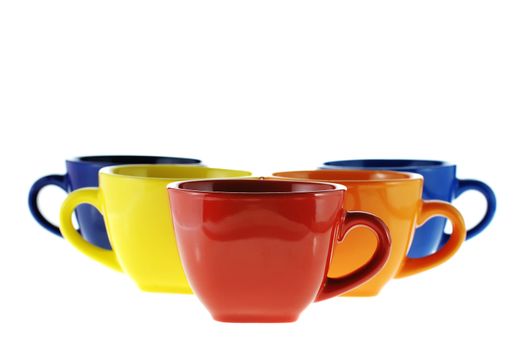 Color cups. Ceramic service from color cups