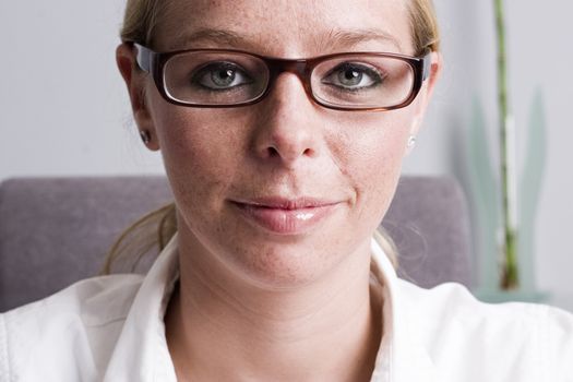 Studio portrait of a beautyfull blond model with a pair of glasses
