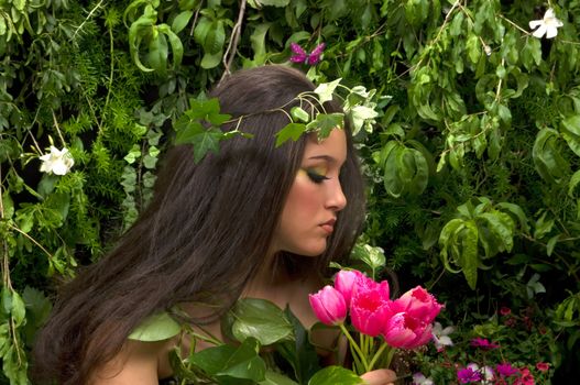 Mother Nature looking upon some of her many beautiful creations in her enchanted garden.
This indoor studio shoot is a compilation of many fresh flowers, grass, tree branches and bushes. 

