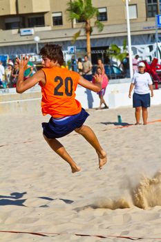 CADIZ, SPAIN - JULY 19: Unidentified players compete in a match between Autoescuela Barquin and CadizSur Seguros BMPY in the 19th league of beach handball of Cadiz on July 19, 2011 in Cadiz, Spain