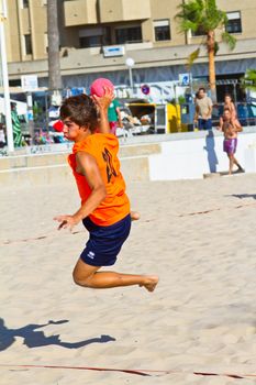 CADIZ, SPAIN - JULY 19: Unidentified players compete in a match between Autoescuela Barquin and CadizSur Seguros BMPY in the 19th league of beach handball of Cadiz on July 19, 2011 in Cadiz, Spain