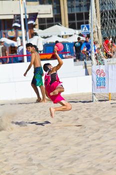 CADIZ, SPAIN - JULY 19: Unidentified players compete in a match between Autoescuela Barquin and CadizSur Seguros BMPY in the 19th league of beach handball of Cadiz on July 19, 2011 in Cadiz, Spain