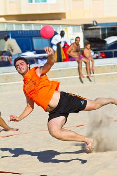 CADIZ, SPAIN - JULY 19: Unidentified players compete in a match between Autoescuela Barquin and CadizSur Seguros BMPY in the 19th league of beach handball of Cadiz on July 19, 2011 in Cadiz, Spain