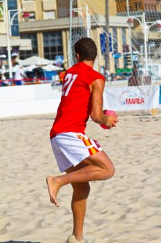 CADIZ, SPAIN - JULY 19: Unidentified players compete in a match between Autoescuela Barquin and CadizSur Seguros BMPY in the 19th league of beach handball of Cadiz on July 19, 2011 in Cadiz, Spain