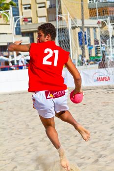 CADIZ, SPAIN - JULY 19: Unidentified players compete in a match between Autoescuela Barquin and CadizSur Seguros BMPY in the 19th league of beach handball of Cadiz on July 19, 2011 in Cadiz, Spain