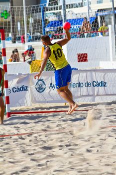 CADIZ, SPAIN - JULY 19: Unidentified players compete in a match between Los Negritos and Ademar Adentro in the 19th league of beach handball of Cadiz on July 19, 2011 in Cadiz, Spain