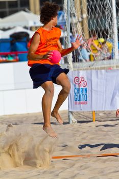 CADIZ, SPAIN - JULY 19: Unidentified players compete in a match between Autoescuela Barquin and CadizSur Seguros BMPY in the 19th league of beach handball of Cadiz on July 19, 2011 in Cadiz, Spain