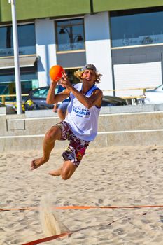 CADIZ, SPAIN - JULY 19: Unidentified players compete in a match between Valcarcel Recuperado and DecoHogar in the 19th league of beach handball of Cadiz on July 19, 2011 in Cadiz, Spain