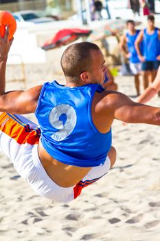 CADIZ, SPAIN - JULY 19: Unidentified players compete in a match between Valcarcel Recuperado and DecoHogar in the 19th league of beach handball of Cadiz on July 19, 2011 in Cadiz, Spain