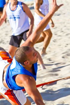 CADIZ, SPAIN - JULY 19: Unidentified players compete in a match between Valcarcel Recuperado and DecoHogar in the 19th league of beach handball of Cadiz on July 19, 2011 in Cadiz, Spain