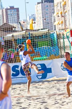 CADIZ, SPAIN - JULY 19: Unidentified players compete in a match between Valcarcel Recuperado and DecoHogar in the 19th league of beach handball of Cadiz on July 19, 2011 in Cadiz, Spain