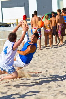 CADIZ, SPAIN - JULY 19: Unidentified players compete in a match between Valcarcel Recuperado and DecoHogar in the 19th league of beach handball of Cadiz on July 19, 2011 in Cadiz, Spain