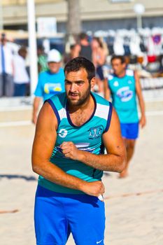 CADIZ, SPAIN - JULY 19: Unidentified players compete in a match between BMPY LAM Chiclana and Los Legendarios in the 19th league of beach handball of Cadiz on July 19, 2011 in Cadiz, Spain
