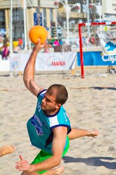 CADIZ, SPAIN - JULY 19: Unidentified players compete in a match between BMPY LAM Chiclana and Los Legendarios in the 19th league of beach handball of Cadiz on July 19, 2011 in Cadiz, Spain