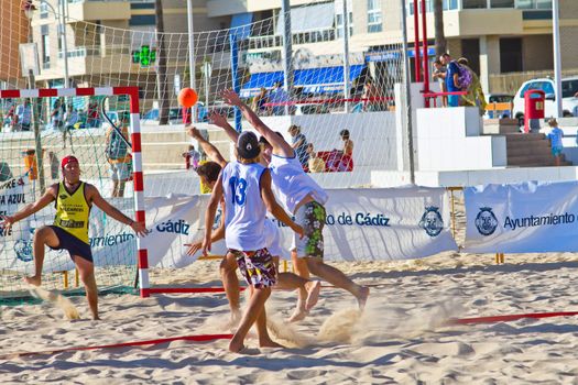 CADIZ, SPAIN - JULY 19: Unidentified players compete in a match between Valcarcel Recuperado and DecoHogar in the 19th league of beach handball of Cadiz on July 19, 2011 in Cadiz, Spain