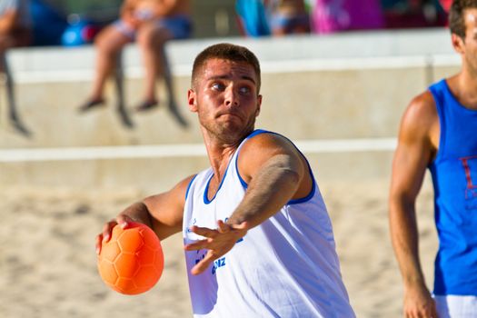 CADIZ, SPAIN - JULY 19: Unidentified players compete in a match between Valcarcel Recuperado and DecoHogar in the 19th league of beach handball of Cadiz on July 19, 2011 in Cadiz, Spain