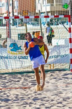 CADIZ, SPAIN - JULY 19: Unidentified players compete in a match between Valcarcel Recuperado and DecoHogar in the 19th league of beach handball of Cadiz on July 19, 2011 in Cadiz, Spain