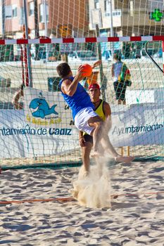 CADIZ, SPAIN - JULY 19: Unidentified players compete in a match between Valcarcel Recuperado and DecoHogar in the 19th league of beach handball of Cadiz on July 19, 2011 in Cadiz, Spain