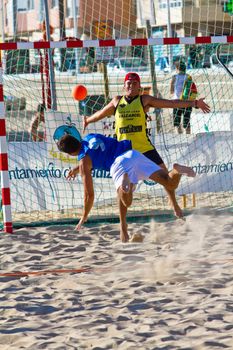CADIZ, SPAIN - JULY 19: Unidentified players compete in a match between Valcarcel Recuperado and DecoHogar in the 19th league of beach handball of Cadiz on July 19, 2011 in Cadiz, Spain