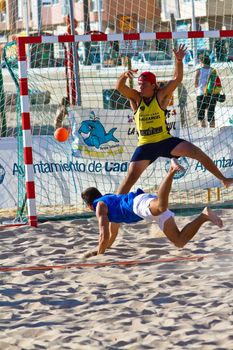 CADIZ, SPAIN - JULY 19: Unidentified players compete in a match between Valcarcel Recuperado and DecoHogar in the 19th league of beach handball of Cadiz on July 19, 2011 in Cadiz, Spain