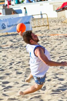 CADIZ, SPAIN - JULY 19: Unidentified players compete in a match between Valcarcel Recuperado and DecoHogar in the 19th league of beach handball of Cadiz on July 19, 2011 in Cadiz, Spain