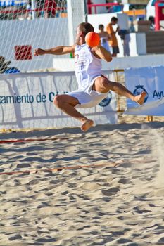 CADIZ, SPAIN - JULY 19: Unidentified players compete in a match between Valcarcel Recuperado and DecoHogar in the 19th league of beach handball of Cadiz on July 19, 2011 in Cadiz, Spain