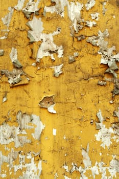 A Old wall with cracked peeling paint