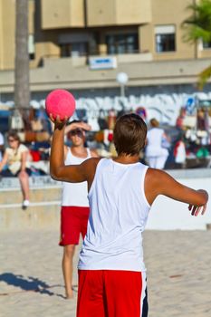 CADIZ, SPAIN - JULY 19: Unidentified players compete in a match between Los Negritos and Autoescuela Barquin in the 19th league of beach handball of Cadiz on July 19, 2011 in Cadiz, Spain