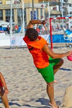 CADIZ, SPAIN - JULY 19: Unidentified players compete in a match between Los Negritos and Autoescuela Barquin in the 19th league of beach handball of Cadiz on July 19, 2011 in Cadiz, Spain