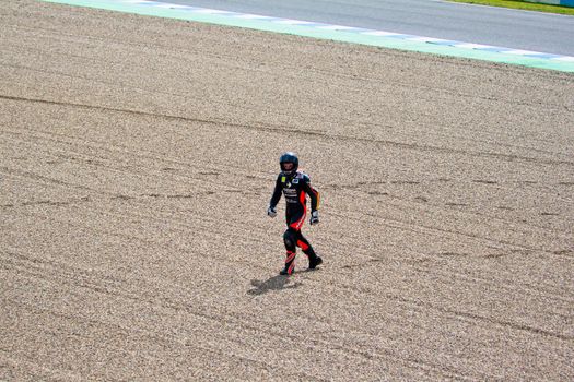 JEREZ DE LA FRONTERA, SPAIN-MAR 5: 125cc motorcyclist Daniel Kartheininge after an accident on the official training of the world championship of MotoGP on March 5, 2011 in Jerez de la Frontera, Spain