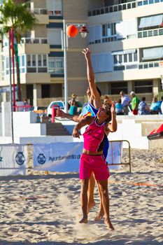 CADIZ, SPAIN - JULY 19: Unidentified players compete in a match between Zonabalonmano.com and CadizSur Seguros BMPY in the 19th league of beach handball of Cadiz on July 19, 2011 in Cadiz, Spain