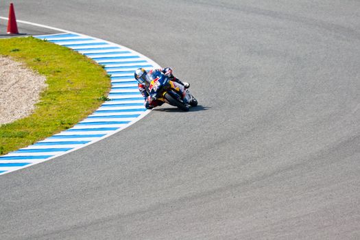 JEREZ DE LA FRONTERA, SPAIN - MAR 5:125cc pilot Jonas Folger takes a curve on the official training of the world championship of MotoGP on Mar 5, 2011, in Jerez de la Frontera, Spain