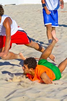 CADIZ, SPAIN - JULY 19: Unidentified players compete in a match between Los Negritos and Autoescuela Barquin in the 19th league of beach handball of Cadiz on July 19, 2011 in Cadiz, Spain