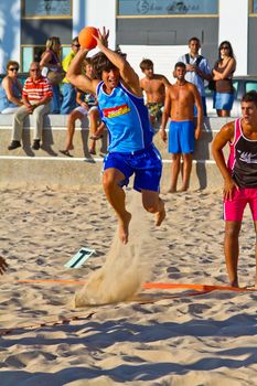 CADIZ, SPAIN - JULY 19: Unidentified players compete in a match between Zonabalonmano.com and CadizSur Seguros BMPY in the 19th league of beach handball of Cadiz on July 19, 2011 in Cadiz, Spain